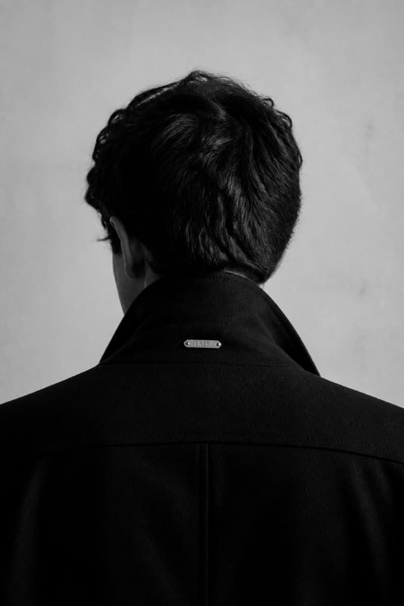 Elena Morales, seen from behind in black and white